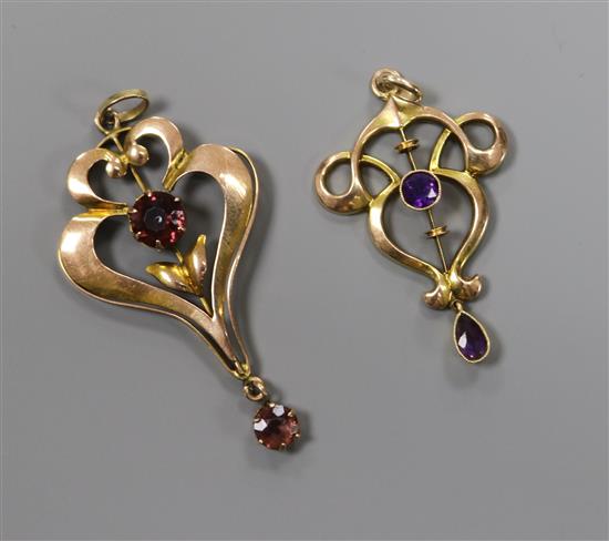Two Edwardian Art Nouveau yellow metal and gem set drop pendants, one stamped 9ct, largest 42mm.